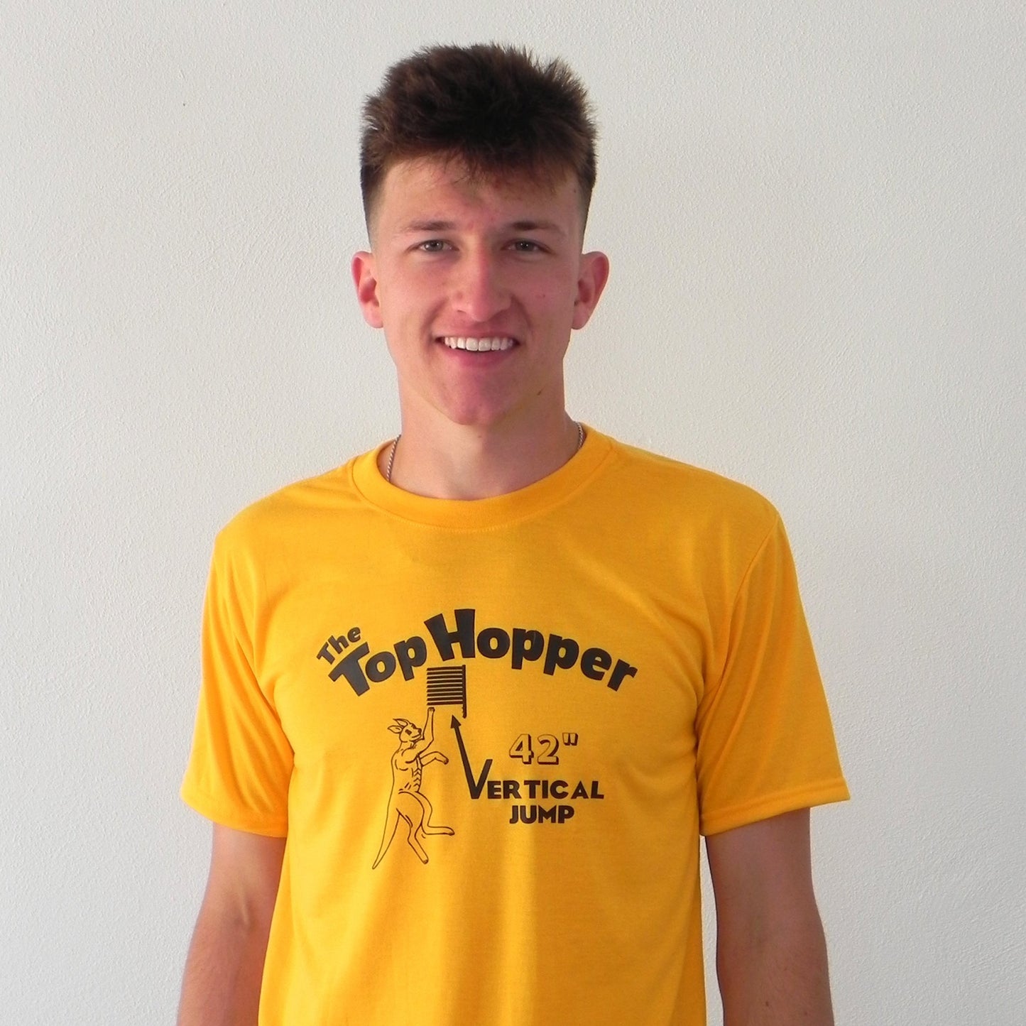 "THE TOP HOPPER VERTICAL JUMP GOLD SHIRT"